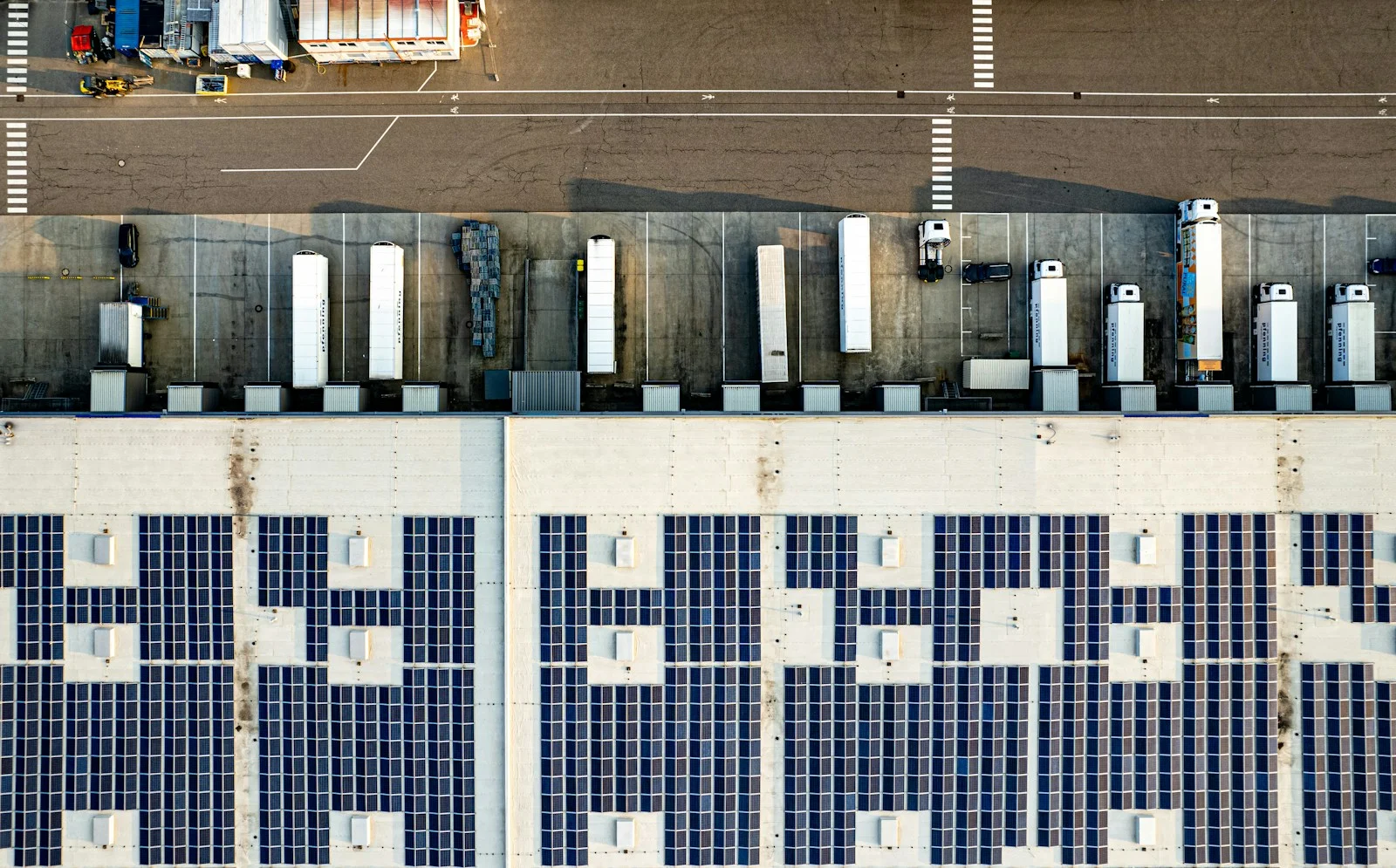 An aerial view of solar panels on commercial premises